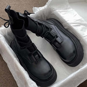 Women's black lace-up Martin boots with a thick sole, stylish and comfortable in packaging.