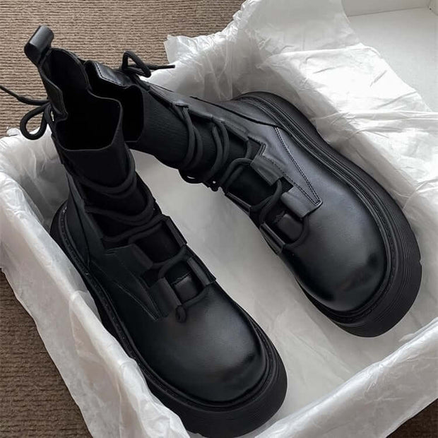 Women's black lace-up Martin boots with a thick sole, stylish and comfortable in packaging.