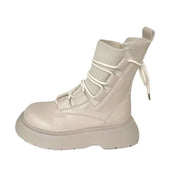 Beige Martin boots with thick sole, lace-up design, ideal for women's casual wear.